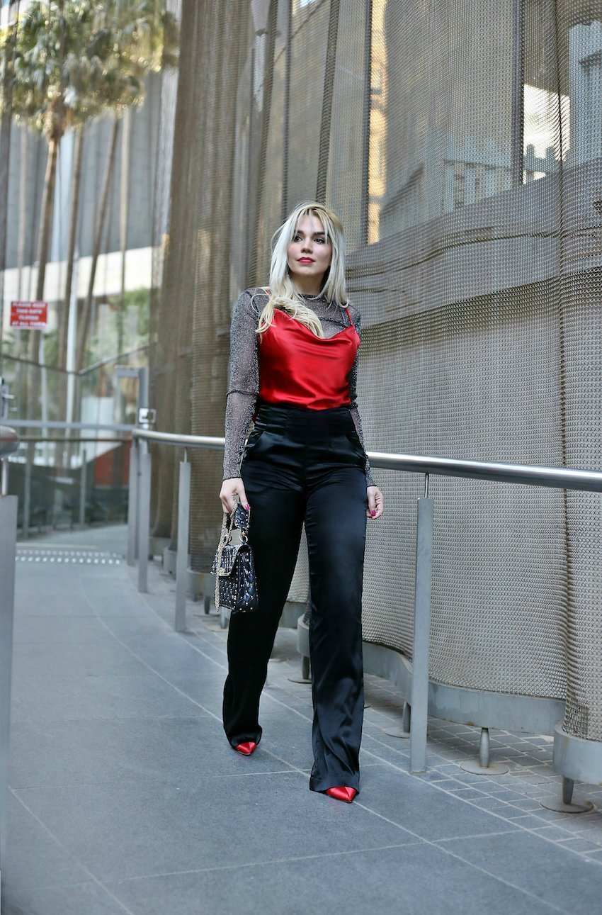 Scarlett Vargas wearing Don't Do Pretty silk pants cocktail style